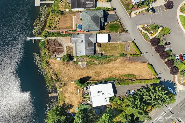 an aerial view of a house with outdoor space