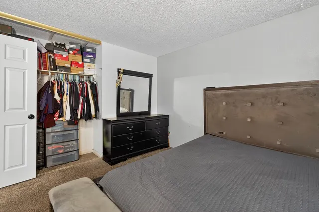 a view of room with furniture and closet