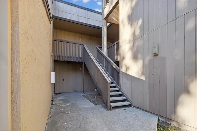 a view of entryway and hall with a wooden floor