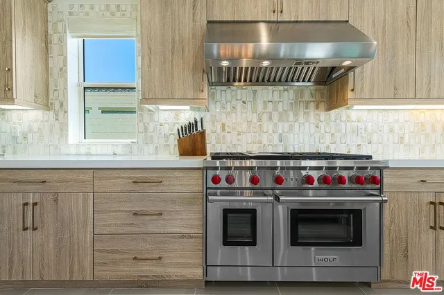 a kitchen with a stove and a microwave