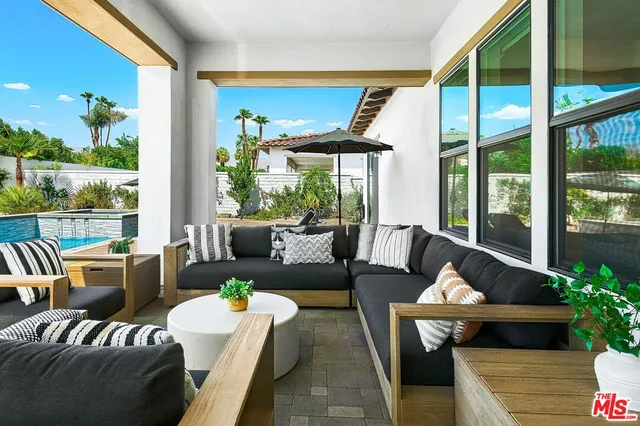 a view of a swimming pool with a balcony