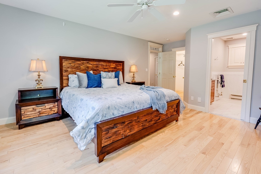 3 W Hollow Andover, MA 01810 - Photo 22 of 37 a bedroom with a bed and a lamp on table