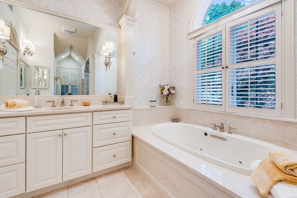 3 W Hollow Andover, MA 01810 - Photo 30 of 37 a bathroom with a granite countertop sink mirror and a bathtub