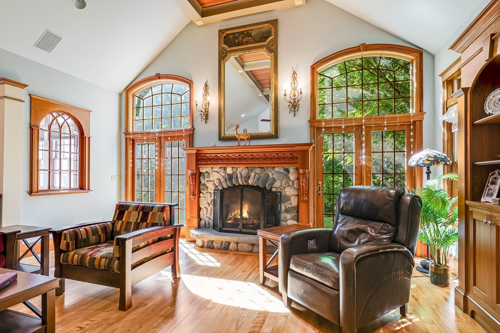 3 W Hollow Andover, MA 01810 - Photo 9 of 37 a living room with furniture fireplace and flat screen tv