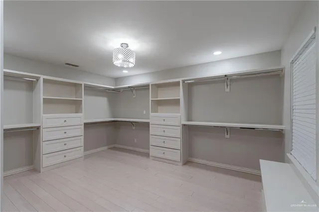 a view of an empty walk in closet