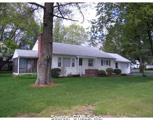 10 Fox Den Road Bristol, CT 06010 - Photo 1 of 1 a front view of a house with a garden and trees