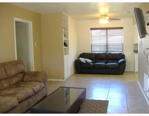 a living room with a couch and a large window