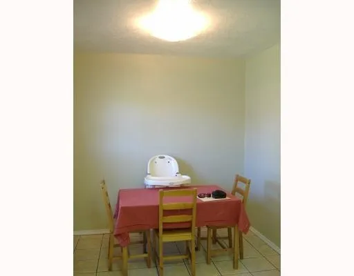 a view of a room with table and chair