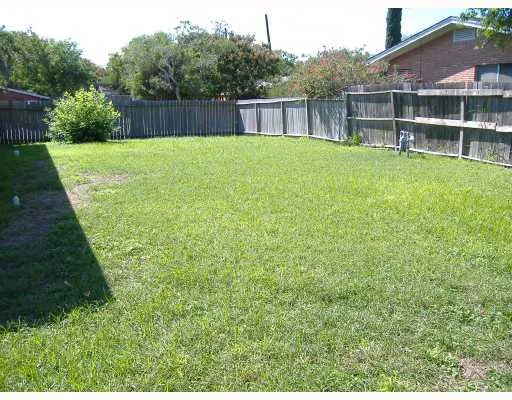 a view of a backyard with a small cabin