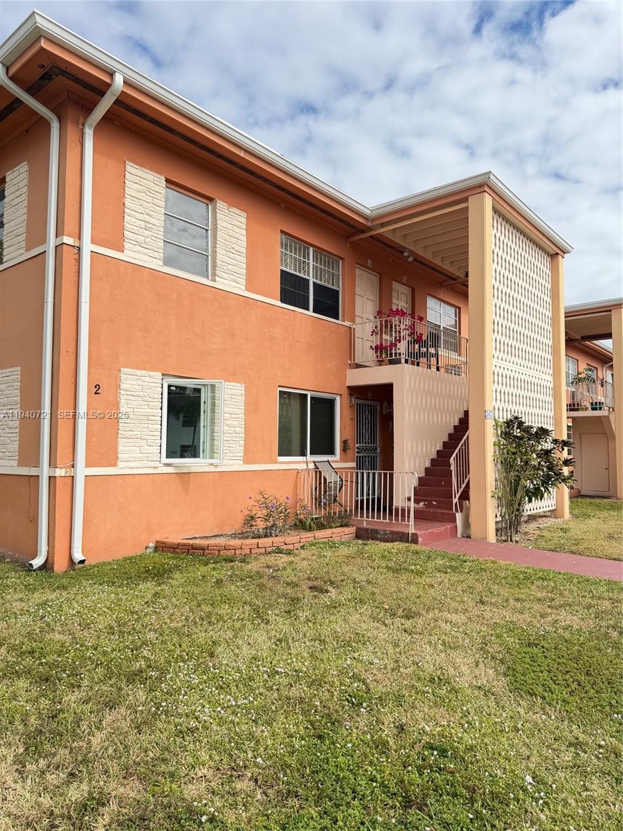 3671 Southwest 10th Street, Unit 9B Miami, FL 33135 - Photo 11 of 15 a front view of a house with a yard