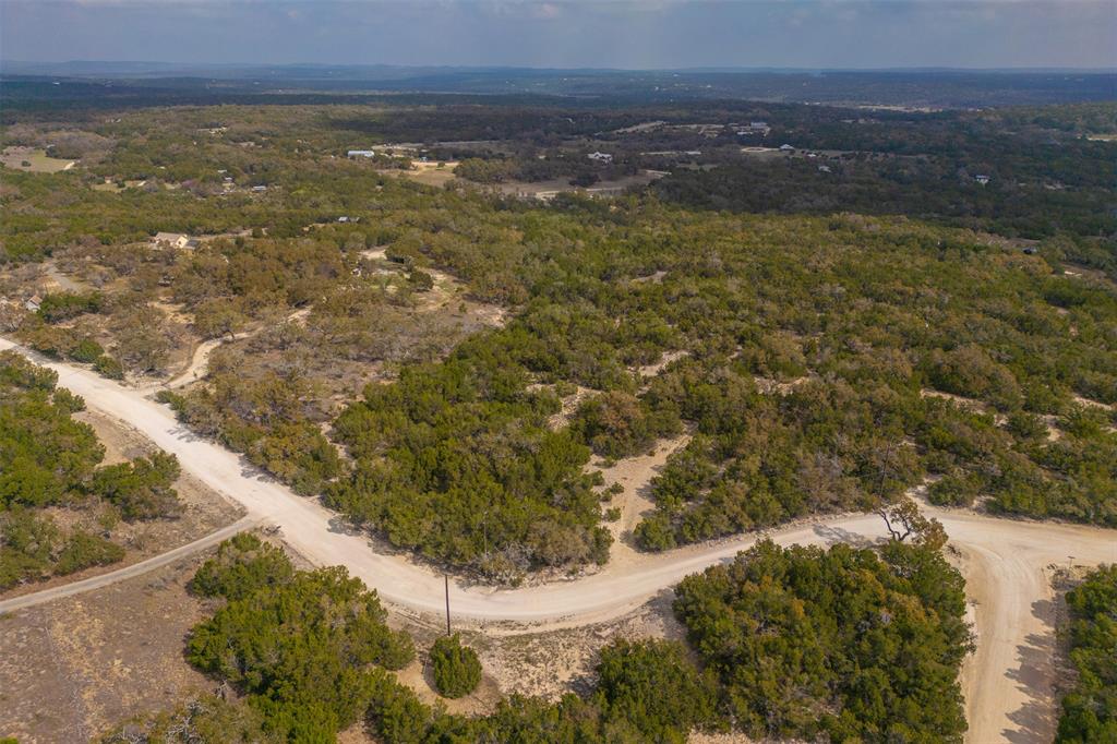 221 Ranch House Road Wimberley, TX 78676 - Photo 2 of 11 Spring Hollow is zoned WISD.