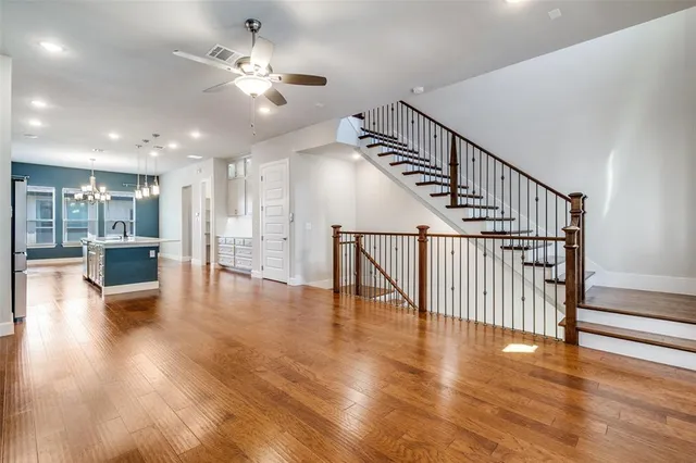 a view of an entryway with wooden floor