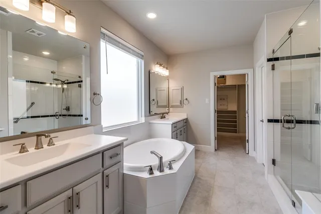 a view of a livingroom with wooden floor and a ceiling fan