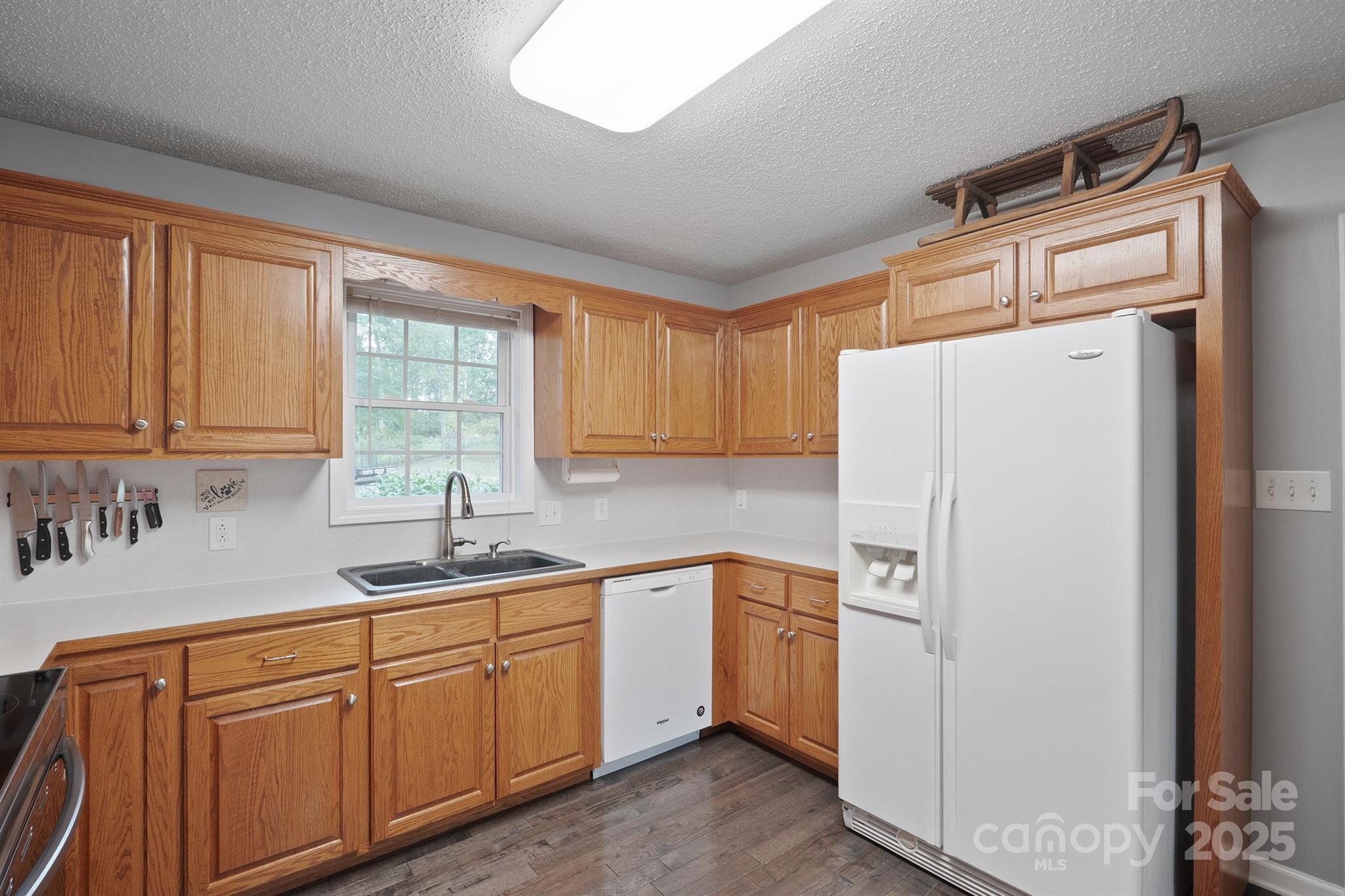 2714 Mauser Drive Newton, NC 28658 - Photo 12 of 38 a kitchen with appliances a sink and cabinets