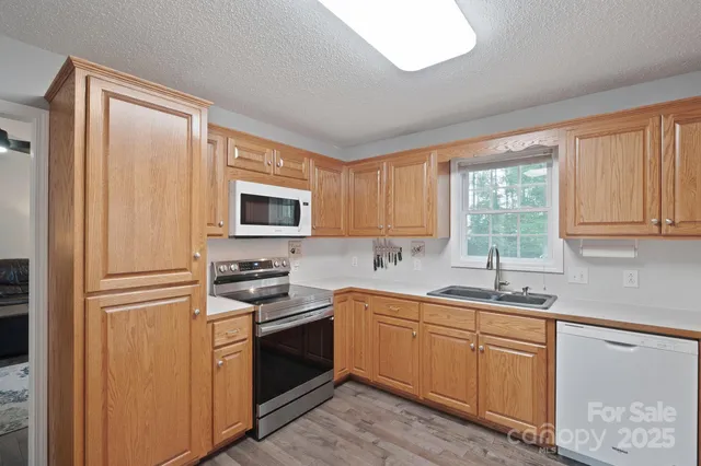 a kitchen with a stove and a sink