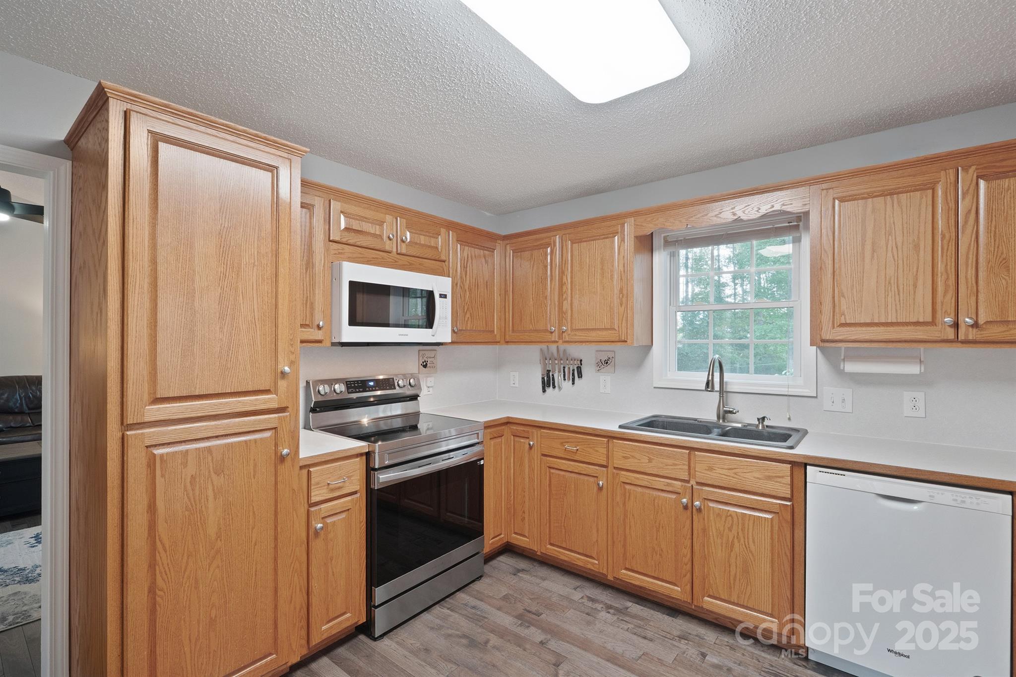 2714 Mauser Drive Newton, NC 28658 - Photo 13 of 38 a kitchen with a sink stove top oven and refrigerator