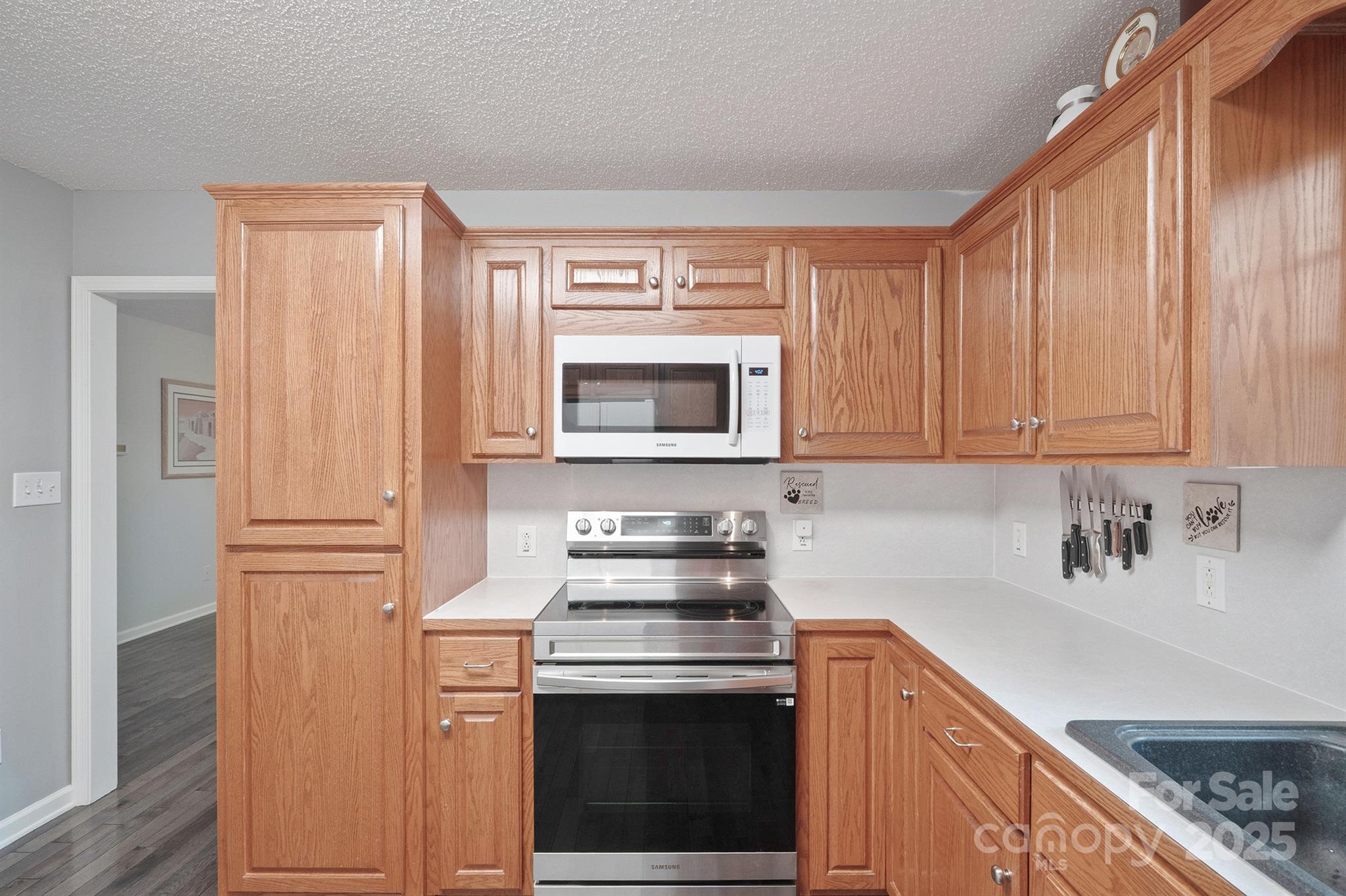2714 Mauser Drive Newton, NC 28658 - Photo 14 of 38 a kitchen with a stove and a sink