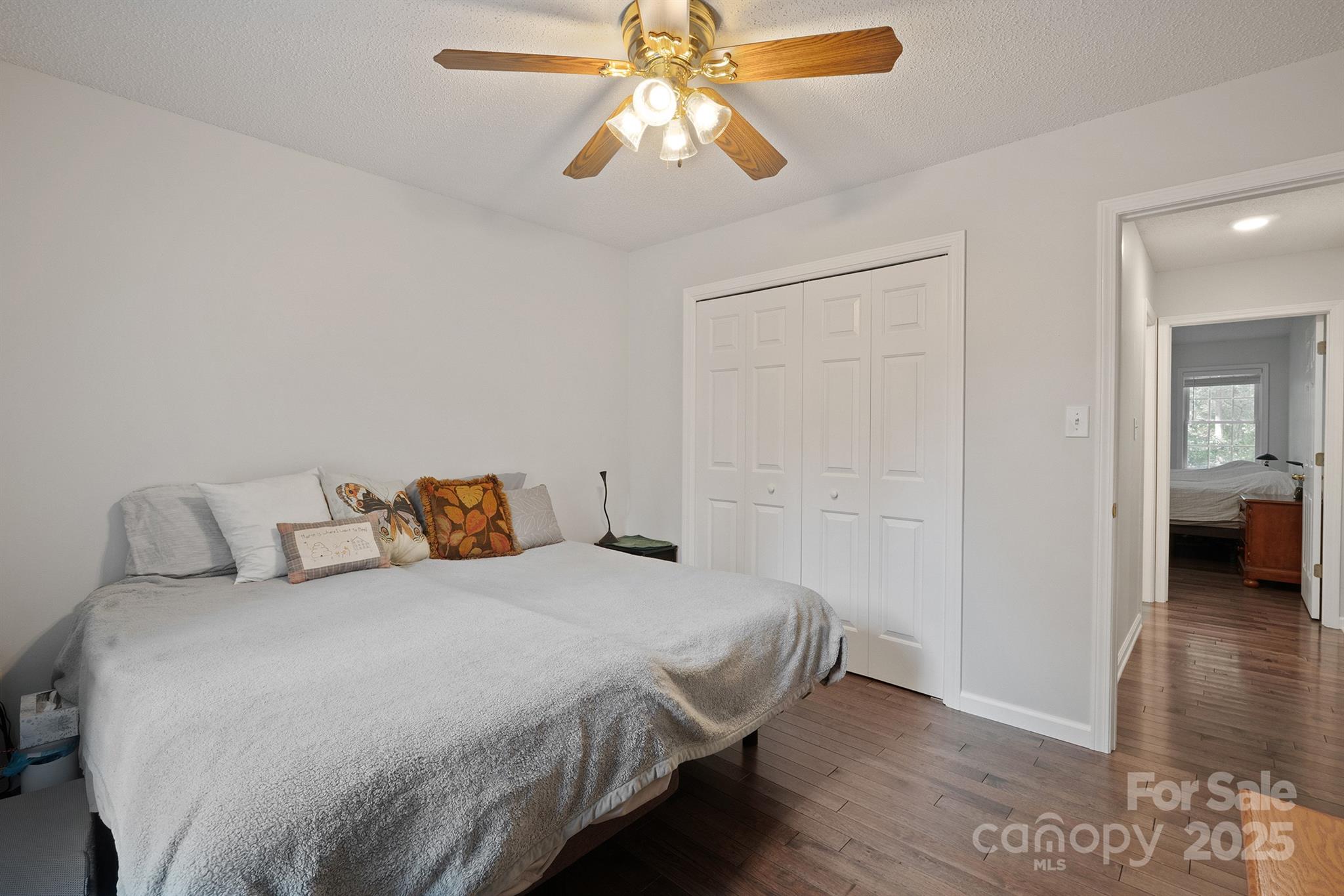 2714 Mauser Drive Newton, NC 28658 - Photo 24 of 38 a bedroom with a bed and a chandelier