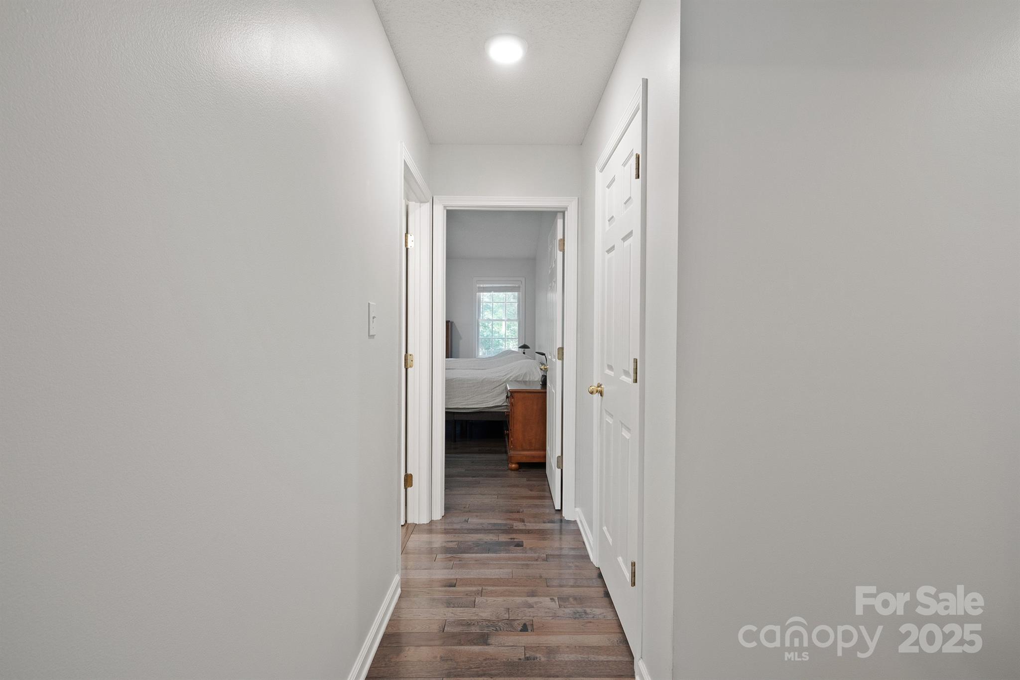 2714 Mauser Drive Newton, NC 28658 - Photo 25 of 38 a view of a hallway with wooden floor and a bathroom