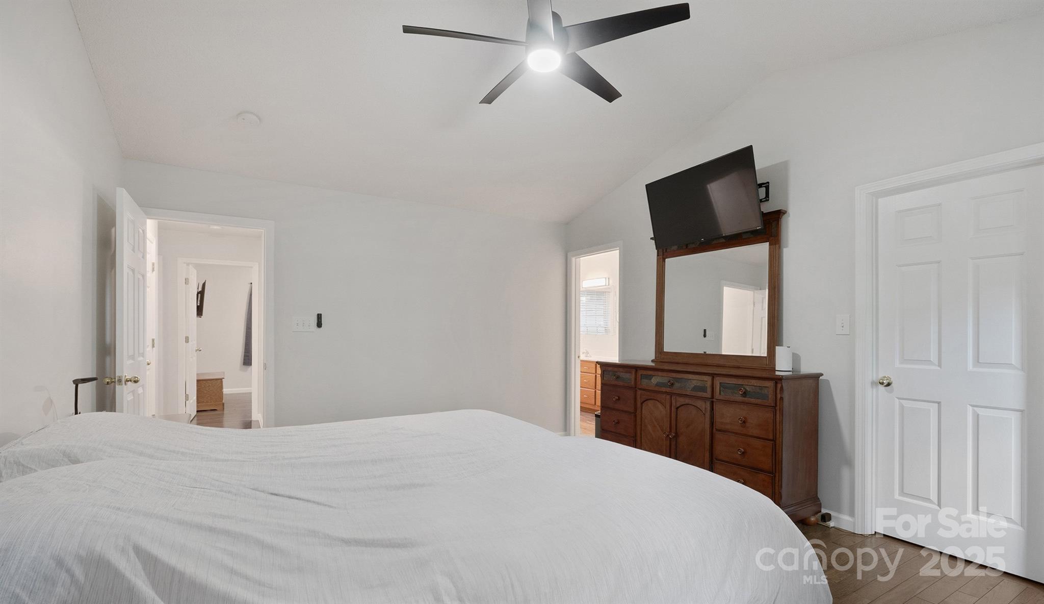 2714 Mauser Drive Newton, NC 28658 - Photo 29 of 38 a bedroom with a bed and a flat tv screen on dresser