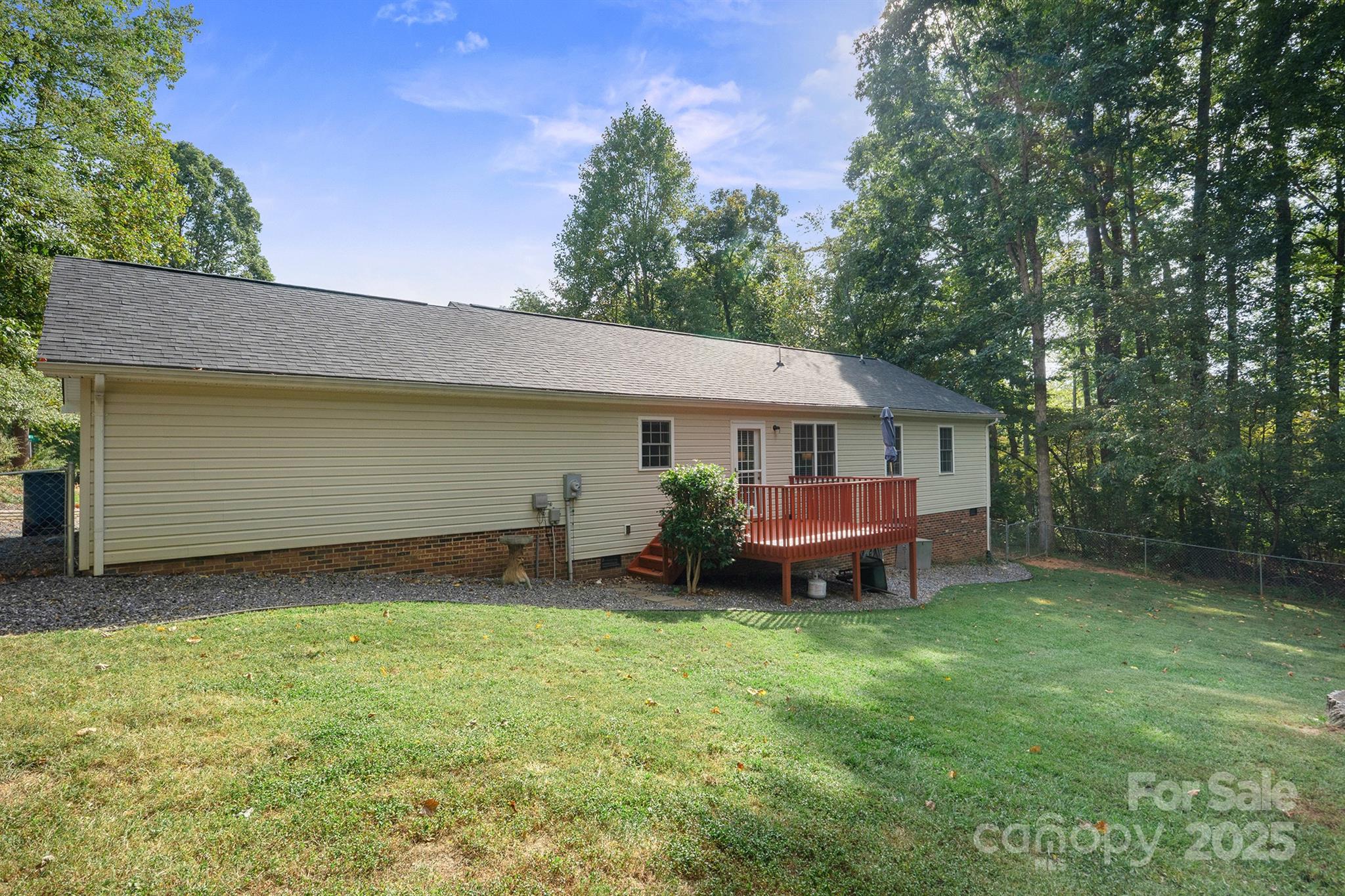 2714 Mauser Drive Newton, NC 28658 - Photo 33 of 38 a backyard of a house with table and chairs