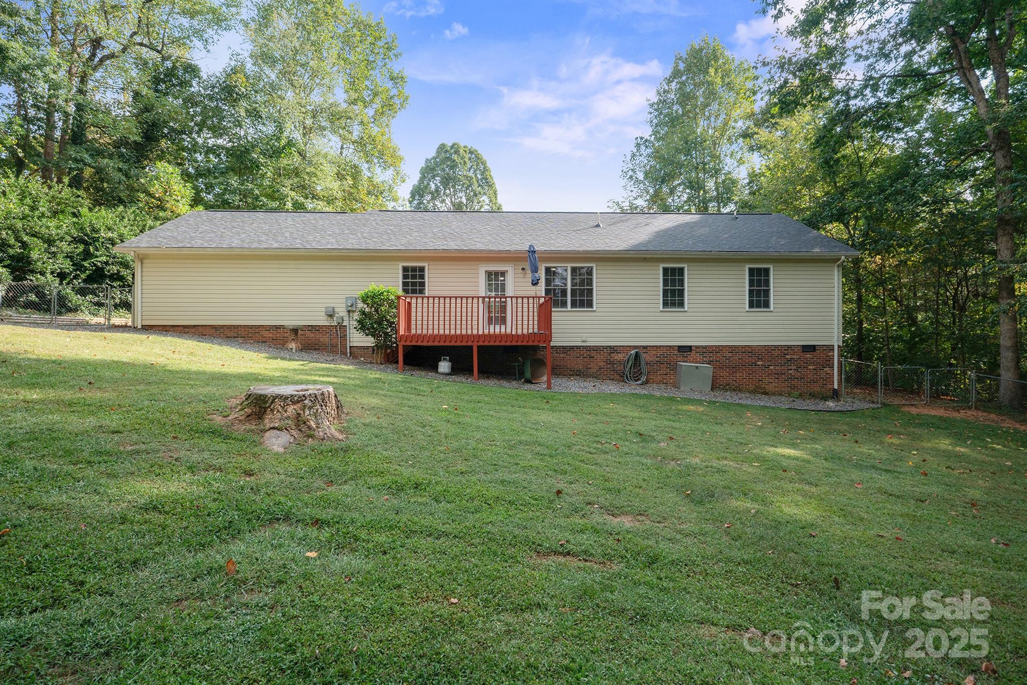 2714 Mauser Drive Newton, NC 28658 - Photo 34 of 38 a backyard of a house with table and chairs