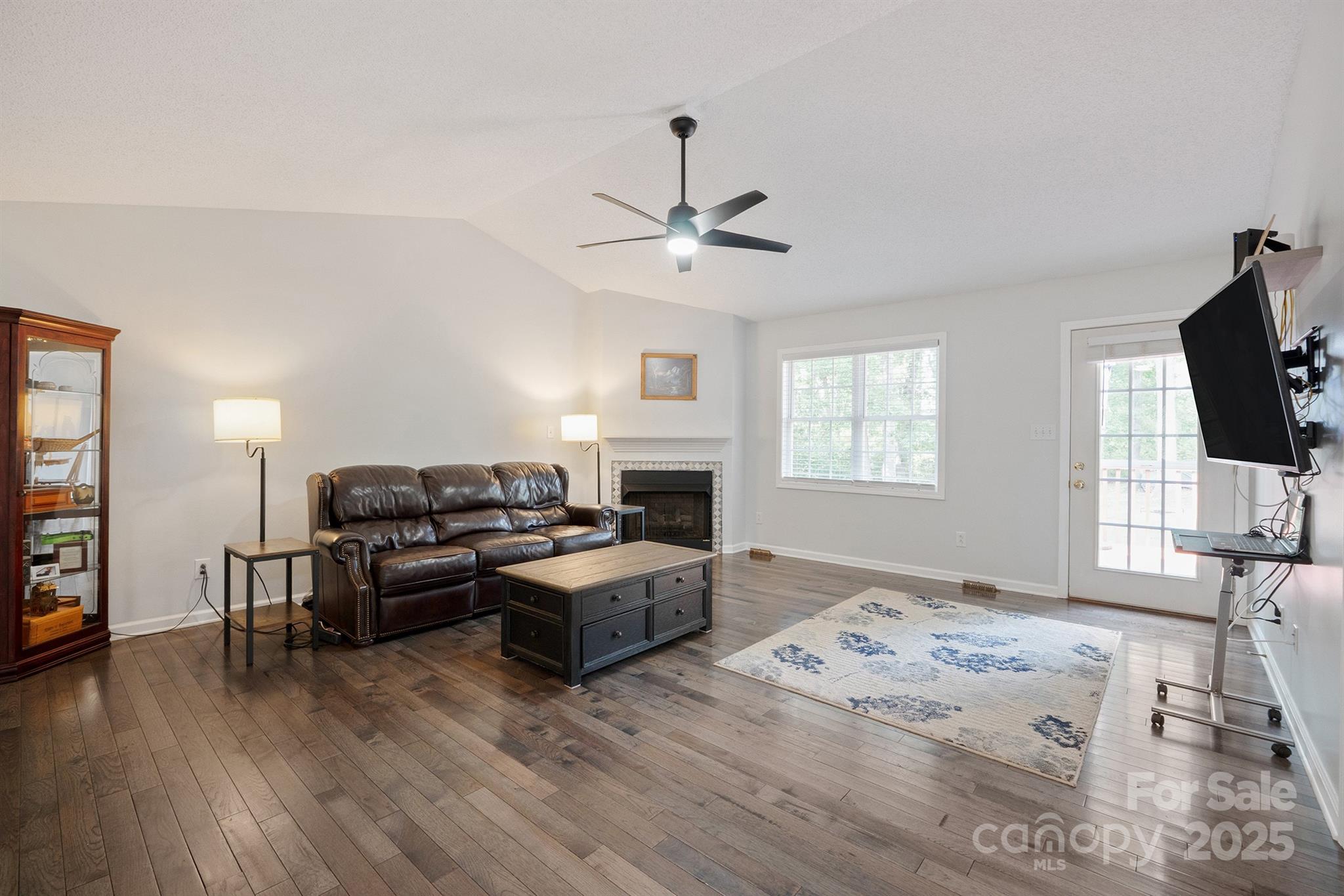 2714 Mauser Drive Newton, NC 28658 - Photo 6 of 38 a living room with furniture a fireplace and a flat screen tv