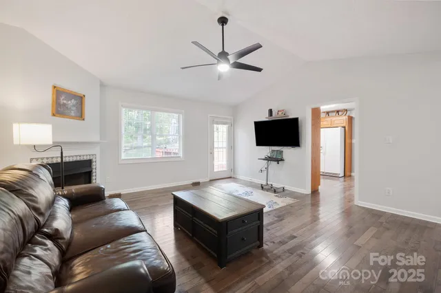 a dining room with furniture window and wooden floor