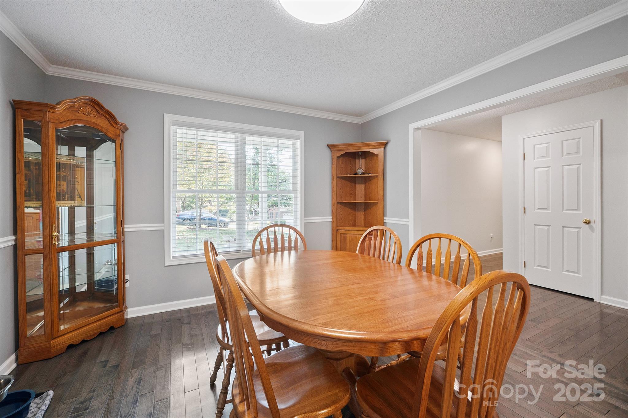 2714 Mauser Drive Newton, NC 28658 - Photo 10 of 38 a view of a a dining room with furniture window and wooden floor