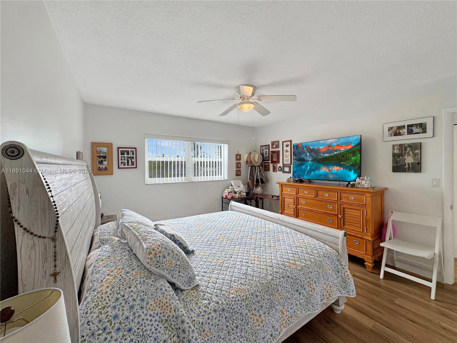 5300 Washington Street, Unit O224 Hollywood, FL 33021 - Photo 8 of 14 a bedroom with a bed and a flat screen tv