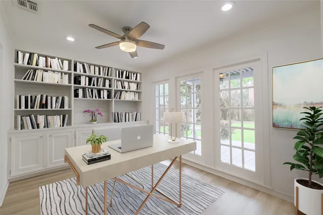 a living room with furniture and a potted plant