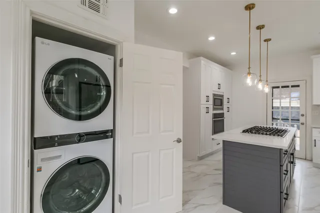 a view of a kitchen with washer and dryer