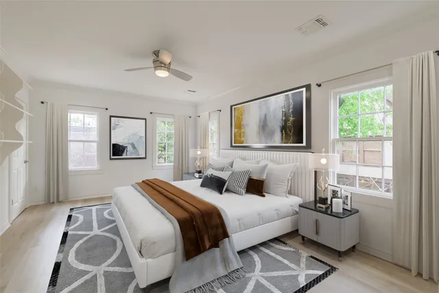 a bedroom with a bed couch and window