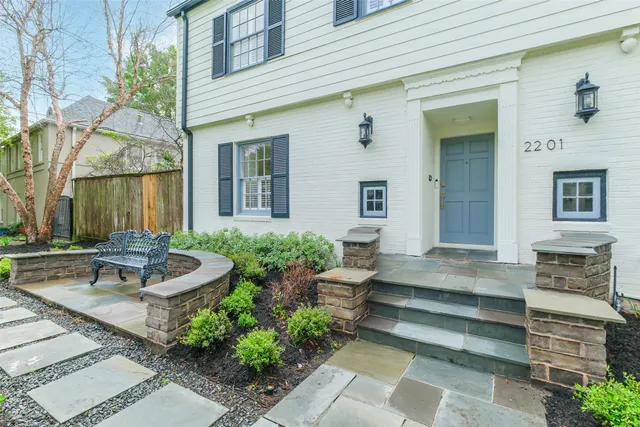 a view of a house with sitting area and fire pit
