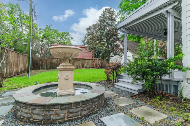 a view of a house with a backyard porch and sitting area