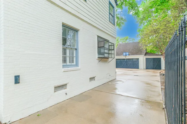 a view of backyard with a large tree