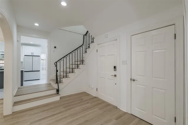 a view of entryway with wooden floor