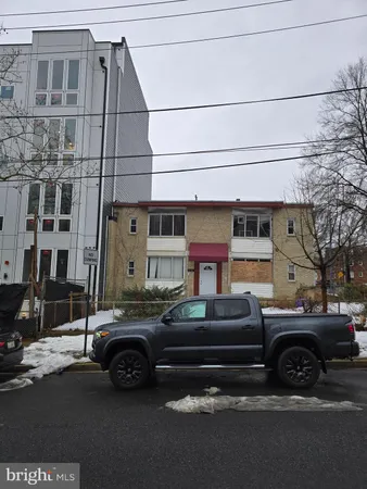 a view of a car parked in front of a building