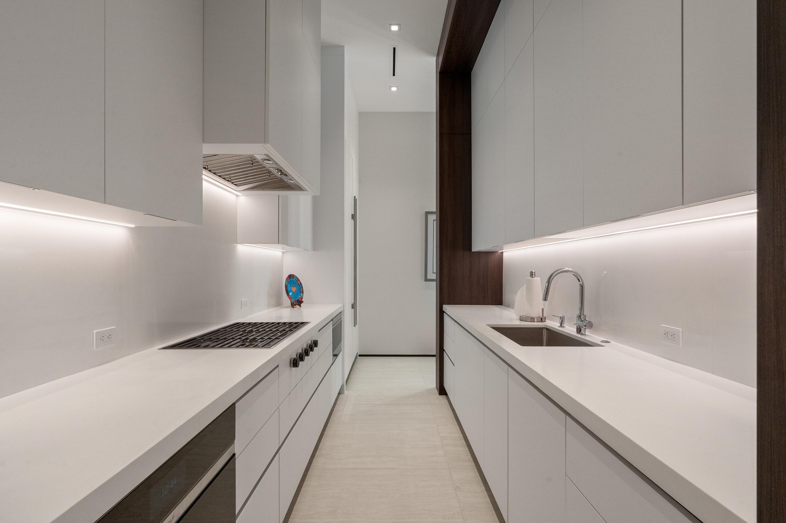 5211 Pennock Point Road Jupiter, FL 33458 - Photo 21 of 69 a kitchen with stainless steel appliances a sink a stove and refrigerator