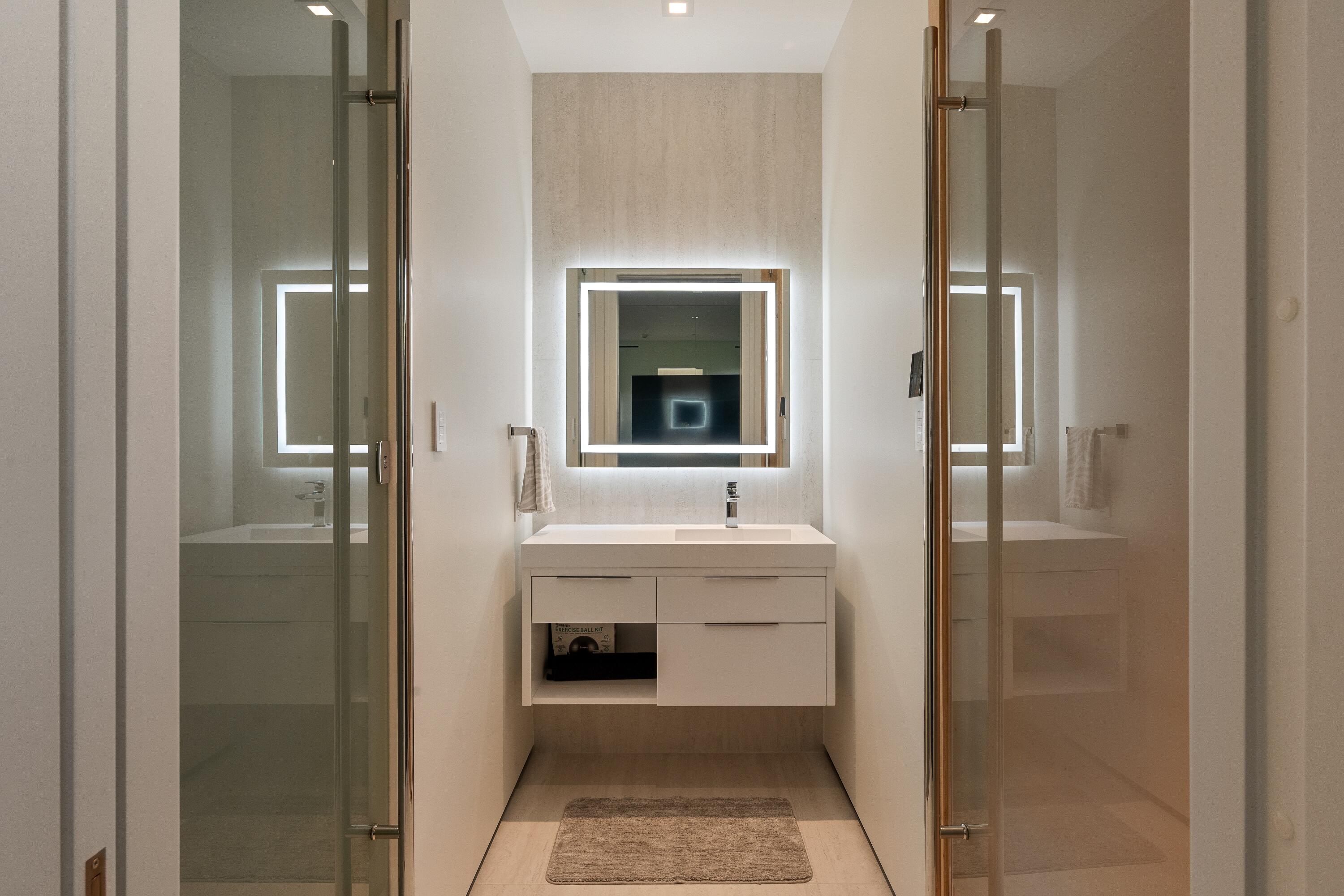 5211 Pennock Point Road Jupiter, FL 33458 - Photo 28 of 69 a bathroom with a sink and mirror