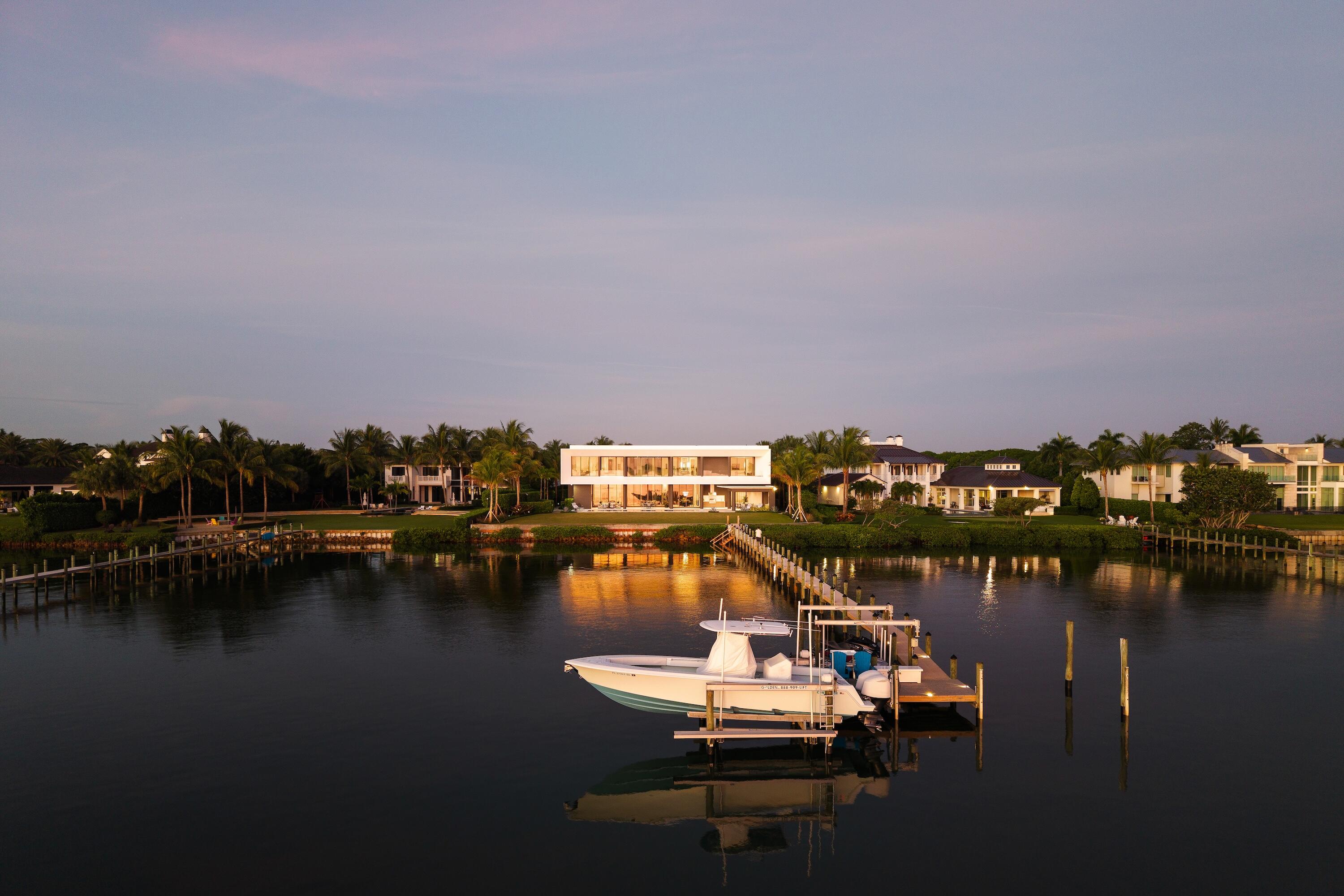 5211 Pennock Point Road Jupiter, FL 33458 - Photo 3 of 69 a view of a lake with boats and trees