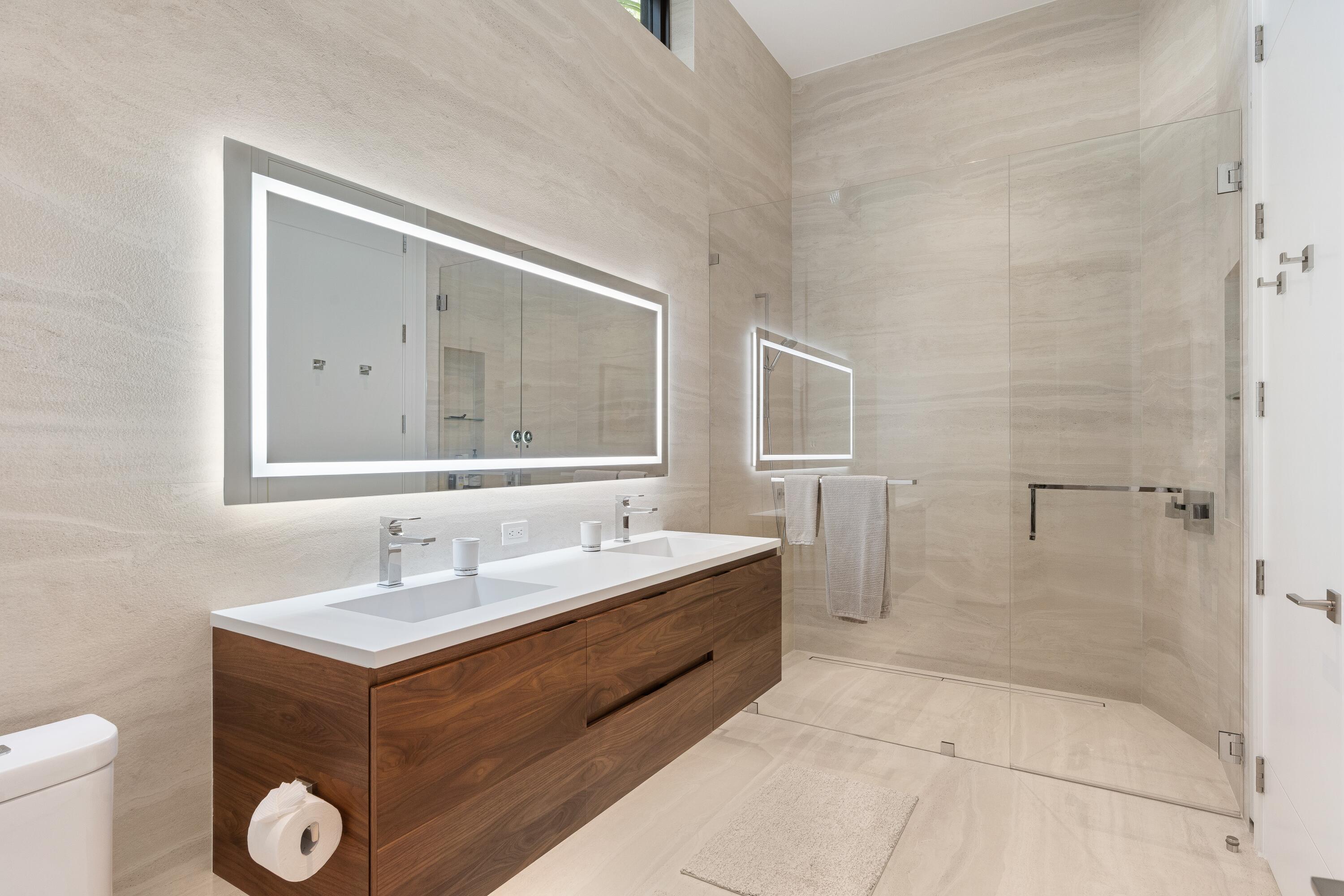 5211 Pennock Point Road Jupiter, FL 33458 - Photo 36 of 69 a bathroom with a double vanity sink mirror and toilet