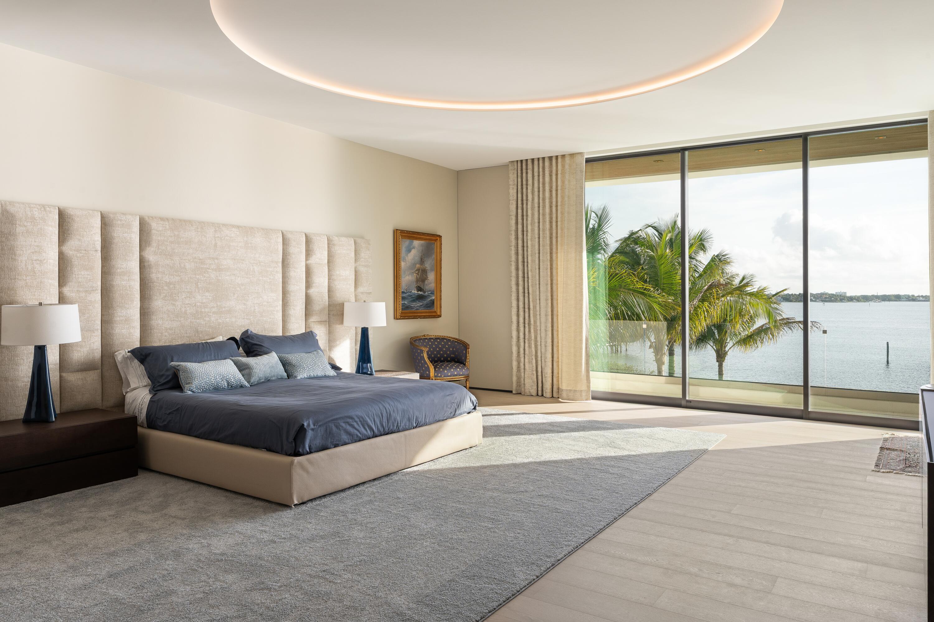 5211 Pennock Point Road Jupiter, FL 33458 - Photo 39 of 69 a spacious bedroom with a large window and a balcony