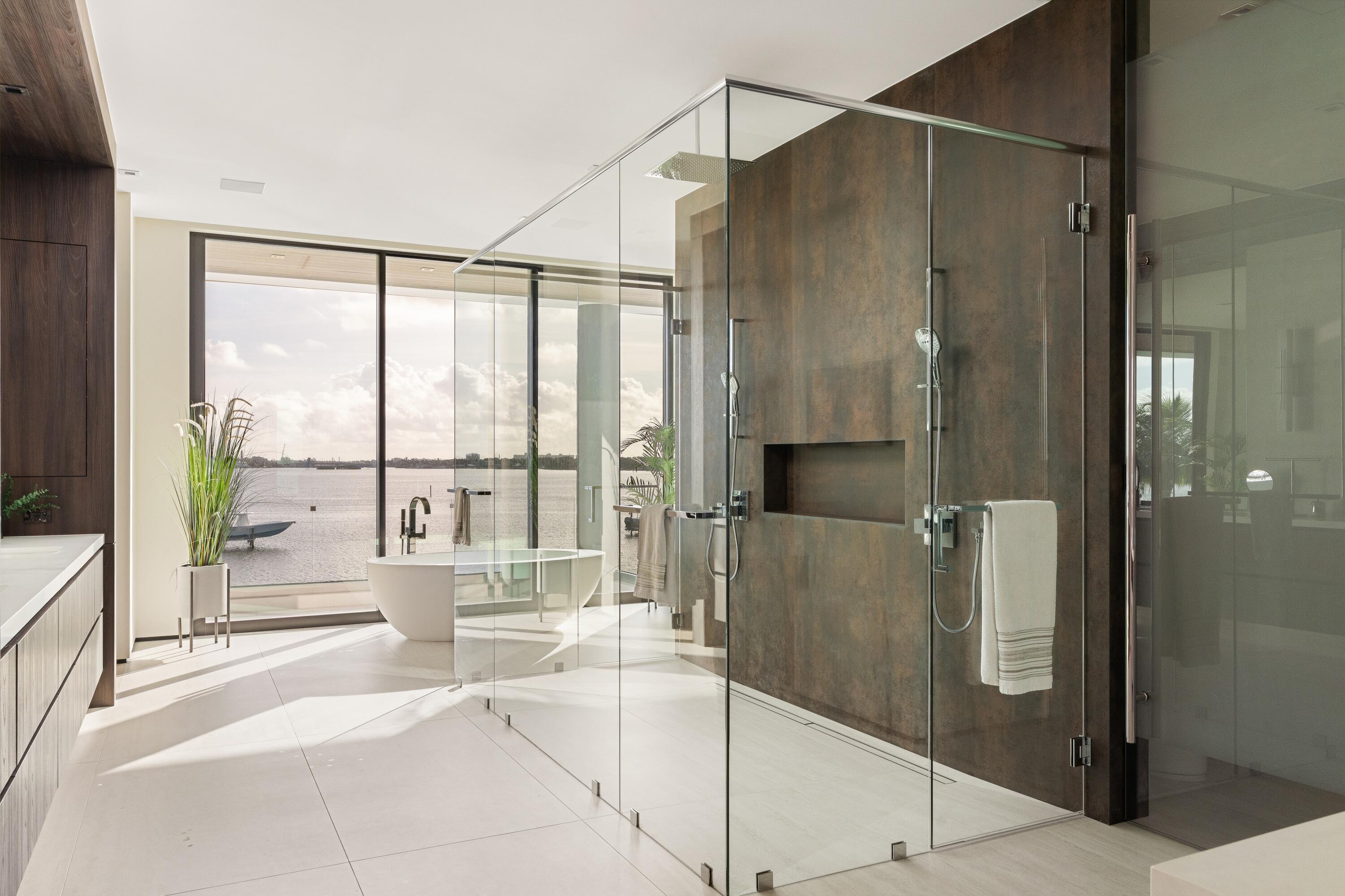 5211 Pennock Point Road Jupiter, FL 33458 - Photo 41 of 69 a spacious bathroom with a glass shower door and a large window