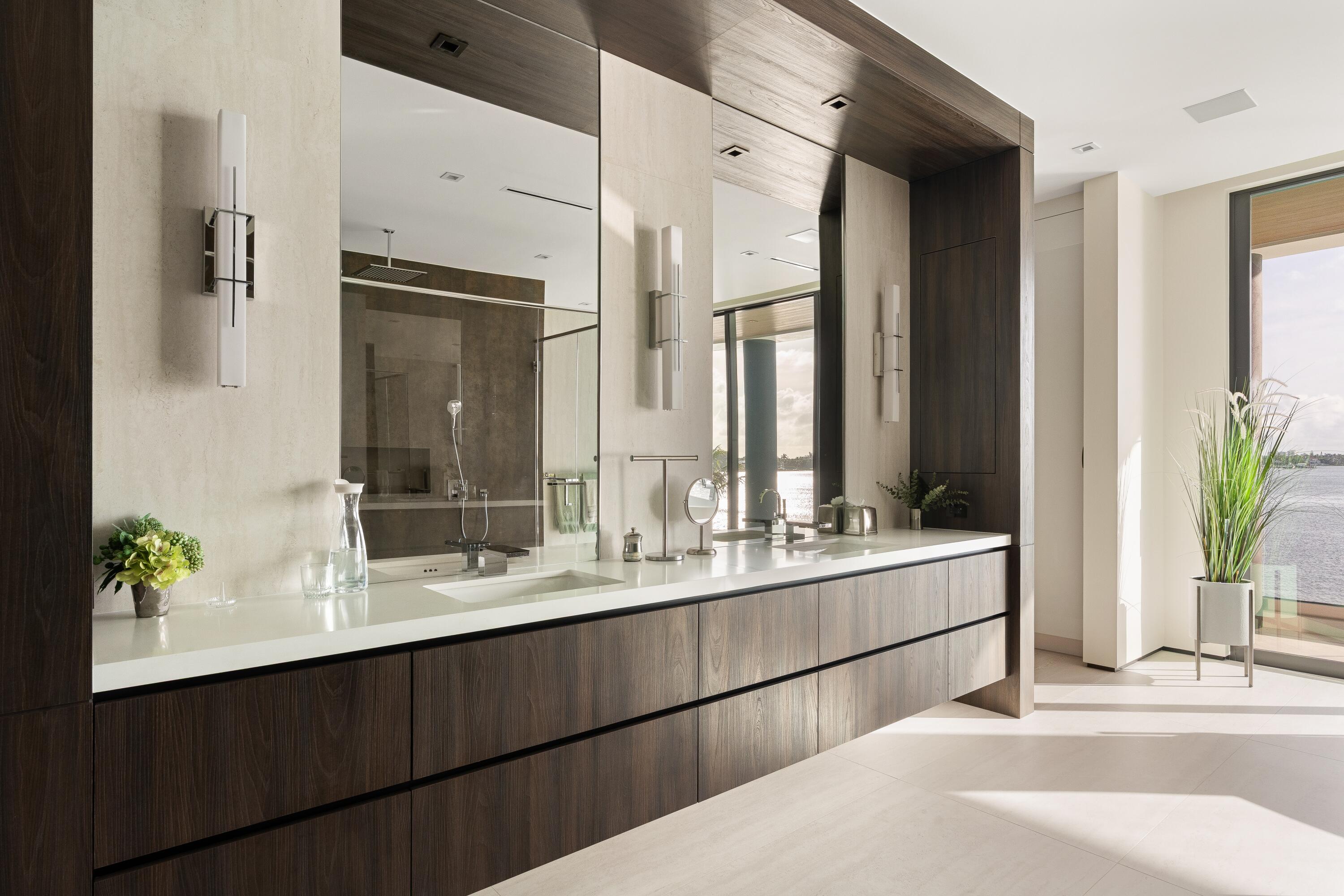 5211 Pennock Point Road Jupiter, FL 33458 - Photo 42 of 69 a bathroom with a double vanity sink and a mirror