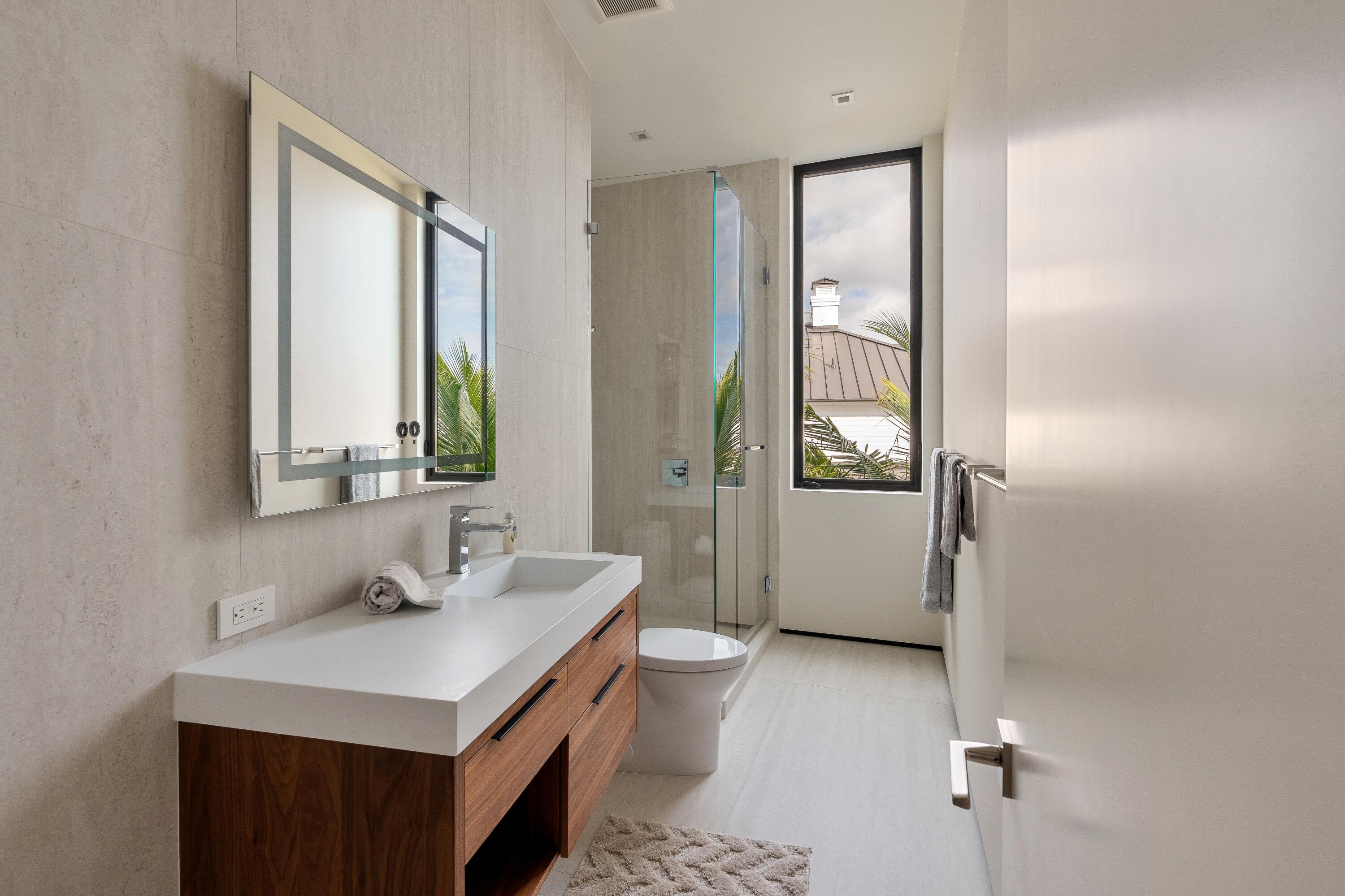 5211 Pennock Point Road Jupiter, FL 33458 - Photo 48 of 69 a bathroom with a sink a toilet and shower