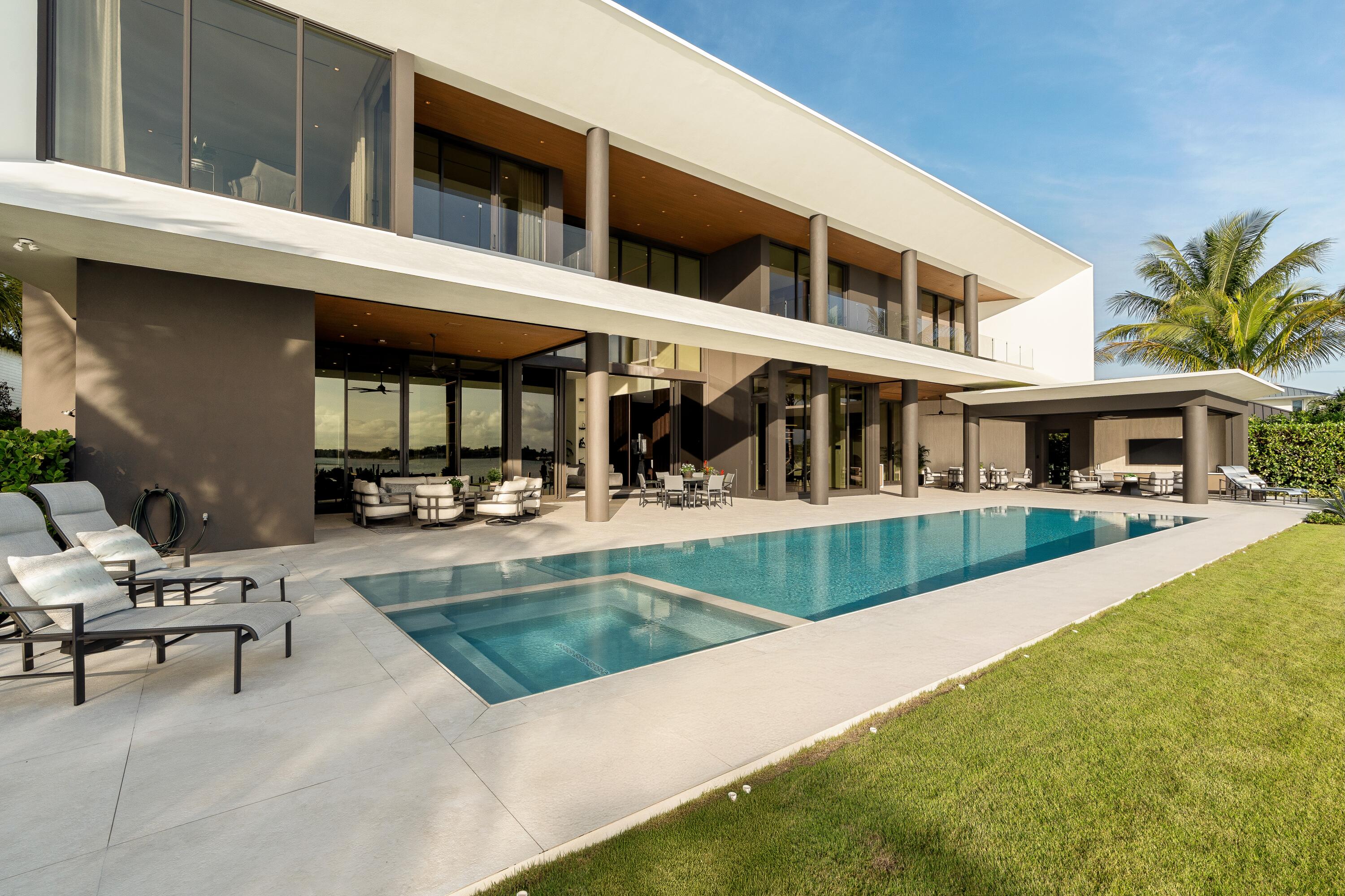 5211 Pennock Point Road Jupiter, FL 33458 - Photo 62 of 69 a view of house with swimming pool and porch