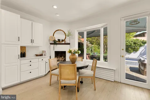 a kitchen with stainless steel appliances granite countertop a stove and white cabinets