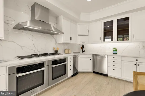 a view of a table and chairs in patio of the house