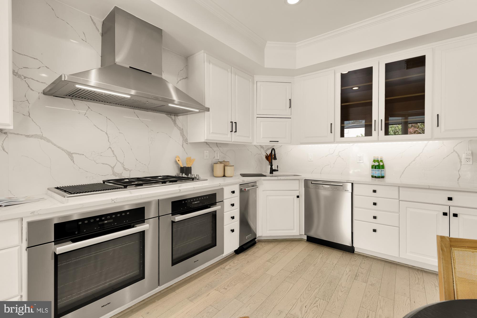 3249 P Street Northwest Washington, DC 20007 - Photo 17 of 63 a kitchen with stainless steel appliances white cabinets and a stove